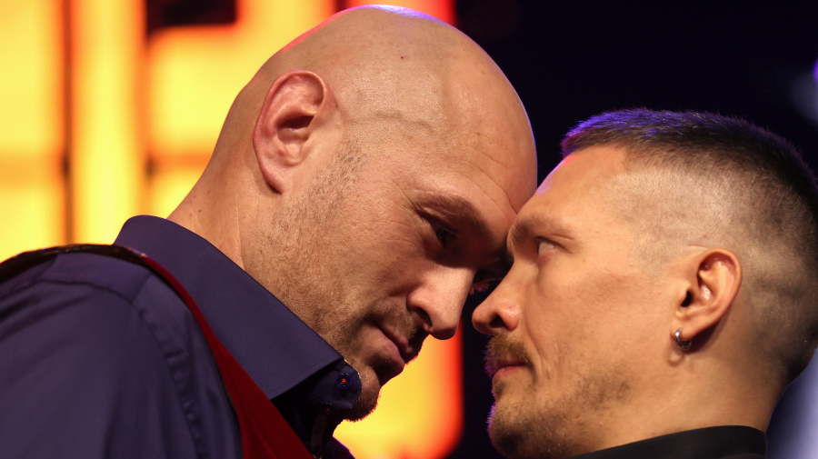 Getty Images - LONDON, ENGLAND - NOVEMBER 16: Tyson Fury and Oleksandr Usyk face off during the Tyson Fury v Oleksandr Usyk Press Conference at Outernet London on November 16, 2023 in London, England. (Photo by Alex Pantling/Getty Images)