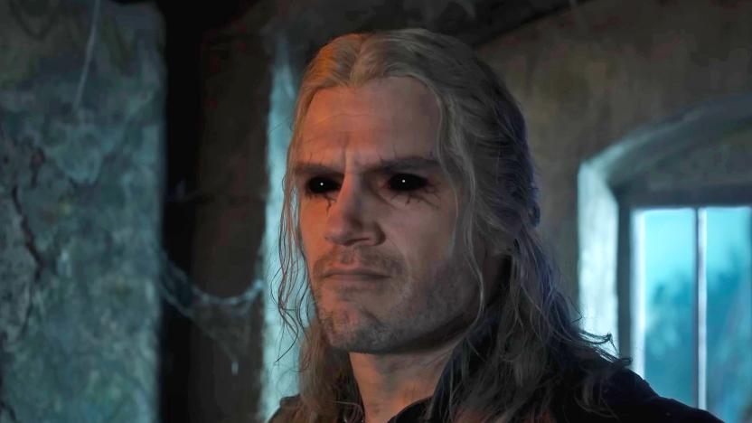 A close up of Henry Cavill as Geralt in 'The Witcher' season 3, showing him with dark black eyes and dark veins surrounding them.