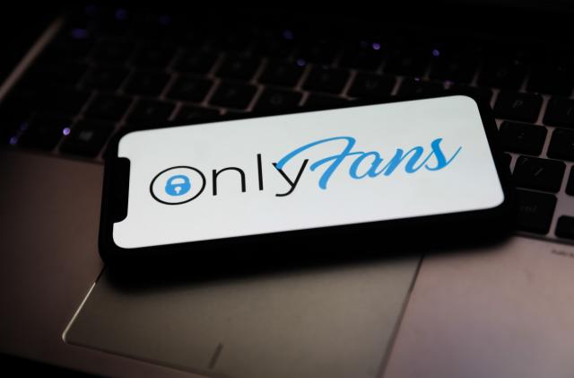 OnlyFans logo is seen displayed on a phone screen in this illustration photo taken in Krakow, Poland on April 27, 2021. (Photo Illustration by Jakub Porzycki/NurPhoto via Getty Images)