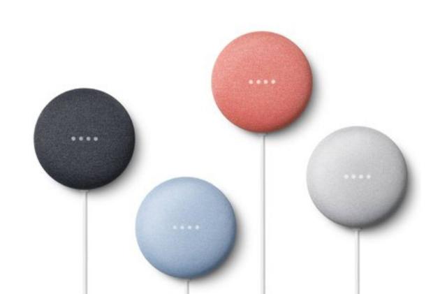 Four of the Google Nest Mini in a mix of colors.