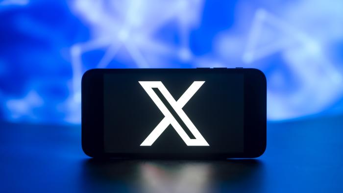 INDIA - 2023/12/18: In this photo illustration, the X (twitter) logo is seen displayed on a mobile phone screen. (Photo Illustration by Idrees Abbas/SOPA Images/LightRocket via Getty Images)