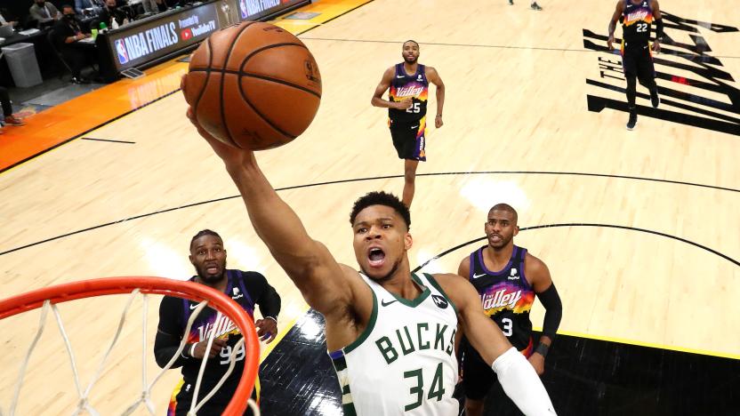 Jul 8, 2021; Phoenix, Arizona, USA; Milwaukee Bucks forward Giannis Antetokounmpo (34) moves in for a basket ahead of Phoenix Suns forward Jae Crowder (99) and guard Chris Paul (3) during game two of the 2021 NBA Finals at Phoenix Suns Arena. Mandatory Credit: Mark J. Rebilas-USA TODAY Sports     TPX IMAGES OF THE DAY