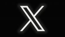 The X logo on a black background with faint scan horizontal scan lines