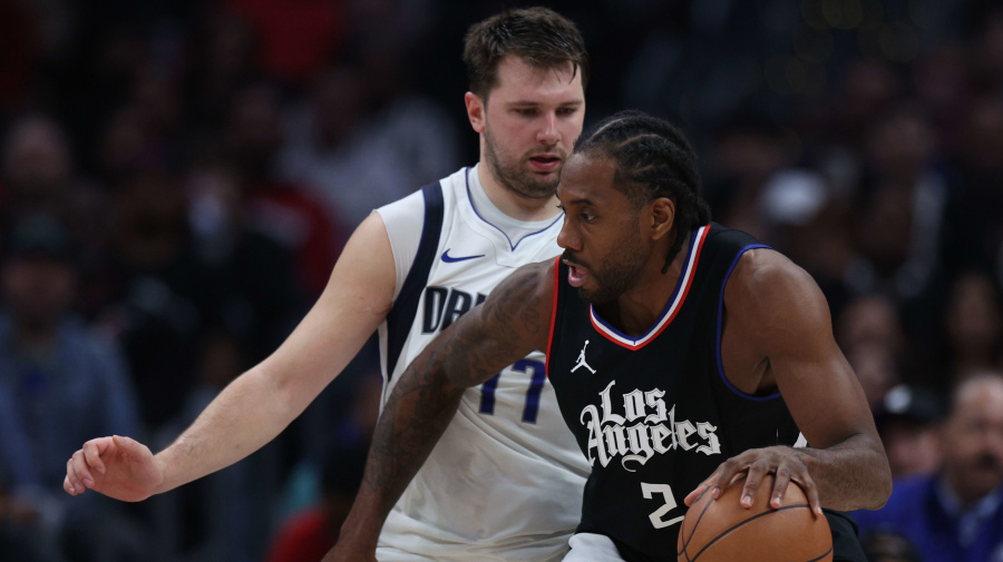 Getty Images - LOS ANGELES, CALIFORNIA - APRIL 23: Luka Doncic #77 of the Dallas Mavericks guards Kawhi Leonard #2 of the LA Clippers during a 96-93 Dallas Mavericks win in game two of the Western Conference First Round Playoffs at Crypto.com Arena on April 23, 2024 in Los Angeles, California. User is consenting to the terms and conditions of the Getty Images License Agreement. (Photo by Harry How/Getty Images)