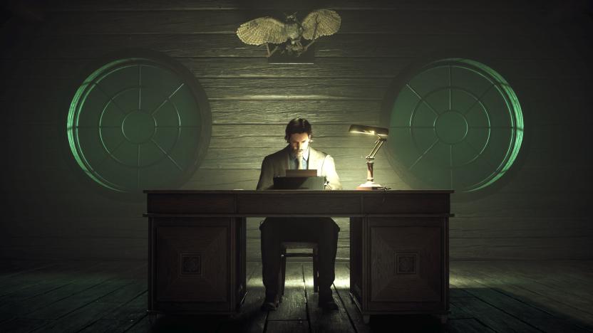 Alan Wake sitting at a typewriter. 