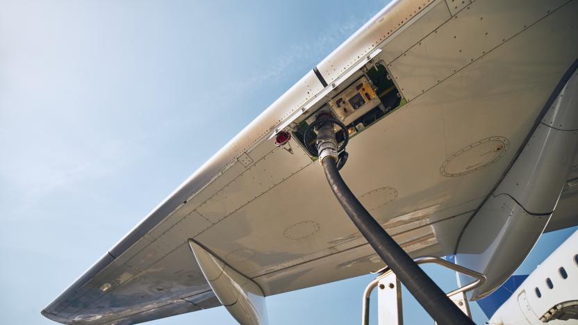 Ground service before flight. Refueling of airplane at airport.