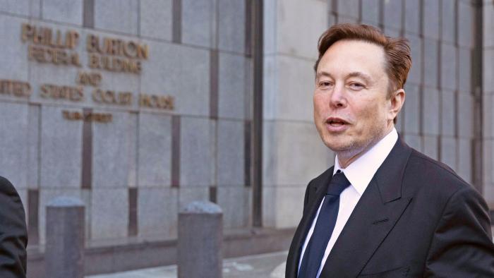 FILE - Elon Musk leaves the Phillip Burton Federal Building and United States Court House in San Francisco, Tuesday, Jan. 24, 2023. A federal appeals court Friday, July 21, said it will reconsider its March ruling that Musk unlawfully threatened employees with a loss of stock options in a 2018 Twitter post amid an organizing effort by the United Auto Workers union.