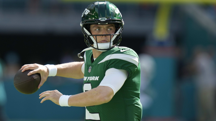 Associated Press - FILE - New York Jets quarterback Zach Wilson (2) warms up before an NFL football game against the Miami Dolphins, Sunday, Dec. 17, 2023, in Miami Gardens, Fla. General manager Joe Douglas was non-committal on the future of the quarterback, who received permission by the Jets during the offseason to seek a trade after a disappointing three years since being the No. 2 overall pick in the NFL draft. (AP Photo/Lynne Sladky, File)