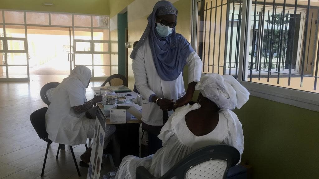 at the Yeumbeul communal hospital, chronically ill patients receive their vaccine