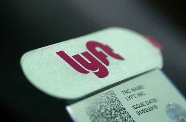 A Lyft <LYFT.O> sticker is seen in a car windscreen in Los Angeles, California, U.S., March 20, 2019.  REUTERS/Lucy Nicholson