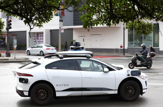 SAN FRANCISCO, CALIFORNIA - APRIL 11: A Waymo autonomous vehicle drives along Masonic Avenue on April 11, 2022 in San Francisco, California. San Francisco is serving as testing grounds for autonomous vehicles with Waymo, a Google subsidiary and Cruise, a subsidiary of General Motors, logging millions of test miles throughout San Francisco in 2021. (Photo by Justin Sullivan/Getty Images)