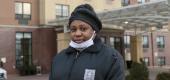 Amber Drummond outside the homeless shelter where she works as a security guard in Queens. (New York Times)