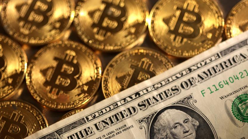 Representations of cryptocurrency Bitcoin and U.S. dollar are seen in this illustration, August 10, 2022. REUTERS/Dado Ruvic/Illustration