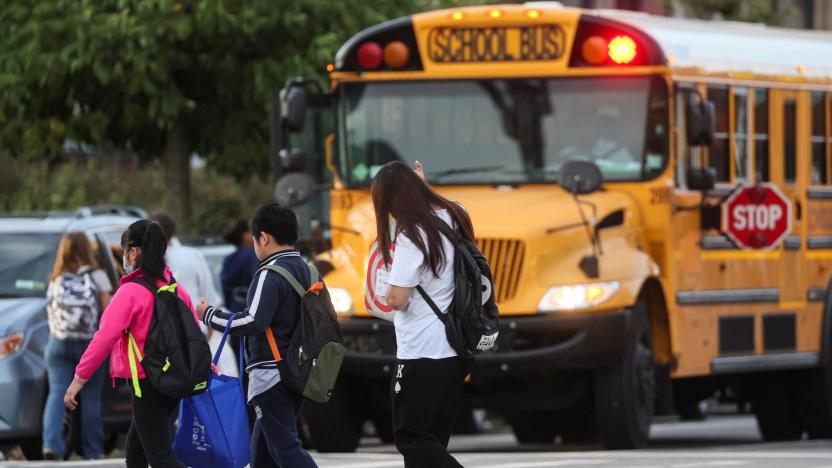 A family walks to school together on the first day of New York City Public Schools in the Brooklyn borough of New York, U.S., September 8, 2022.  REUTERS/Brendan McDermid