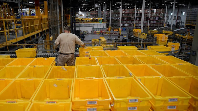 A worker organizes empty bins during Cyber Monday at the Amazon fulfillment center in Robbinsville Township in New Jersey, U.S., November 28, 2022. REUTERS/Eduardo Munoz