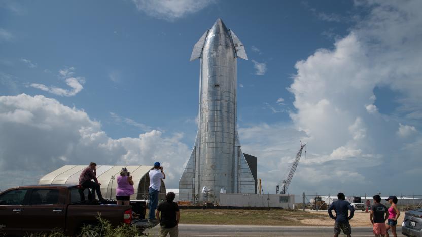 BOCA CHICA, TX - SEPTEMBER 28: Space enthusiasts look at a prototype of SpaceX's Starship spacecraft at the company's Texas launch facility on September 28, 2019 in Boca Chica near Brownsville, Texas. The Starship spacecraft is a massive vehicle meant to take people to the Moon, Mars, and beyond. (Photo by Loren Elliott/Getty Images)