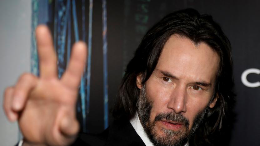 Actor Keanu Reeves gestures during the "Black Carpet" of the Canadian premiere of The Matrix Resurrections film in his former home town of Toronto, Ontario, Canada, December 16, 2021.  REUTERS/Carlos Osorio