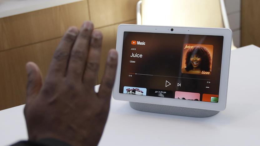 Google's Kayitta Johnson gives a demonstration of the Nest Hub Max by putting up his hand to control the device at the Google I/O conference in Mountain View, Calif., Tuesday, May 7, 2019. (AP Photo/Jeff Chiu)