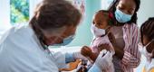 A mother takes her daughter to the pediatrician to get vaccinated. (Getty Images)