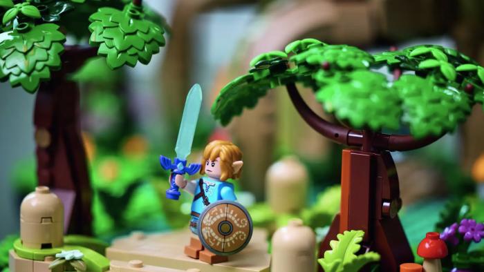 Lego Link holding up the Master Sword.