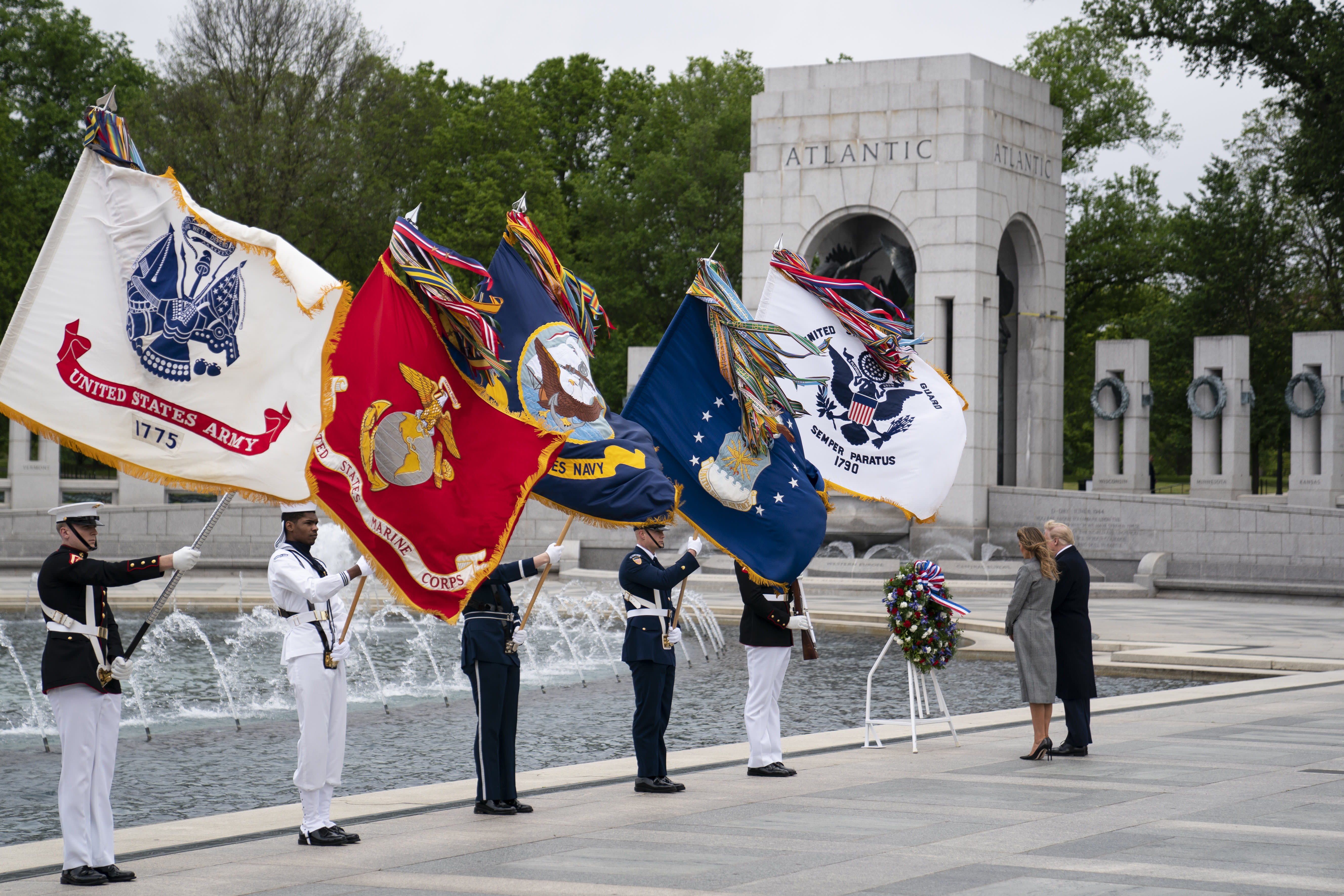 President Donald Trump and first lady Melania Trump participate in a wreath laying ceremony at the World War II Memorial to commemorate the 75th anniversary of Victory in Europe Day, Friday, May 8, 2020, in Washington. (AP Photo/Evan Vucci)