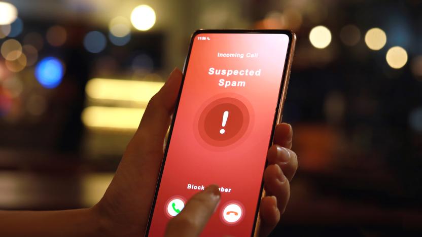 A woman receiving an incoming suspected spam call on her phone. The network provider detect the scam and show warning sign, woman rejects the call.