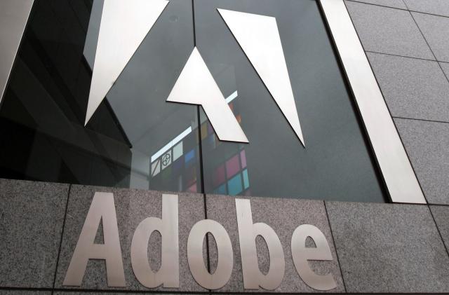 FILE - In this Dec. 13, 2006, file photo, an exterior view of the Adobe headquarters in San Jose, Calif. Software company Adobe is buying online design company Figma in an approximately $20 billion cash-and-stock deal. (AP Photo/Paul Sakuma, File)