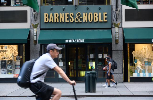 NEW YORK, NEW YORK - JUNE 30: People walk outside the Barnes & Noble book store on Fifth Avenue as New York City moves into Phase 2 of re-opening following restrictions imposed to curb the coronavirus pandemic on June 30, 2020. Phase 2 permits the reopening of offices, in-store retail, outdoor dining, barbers and beauty parlors and numerous other businesses. Phase 2 is the second of four phased stages designated by the state. (Photo by Noam Galai/Getty Images)