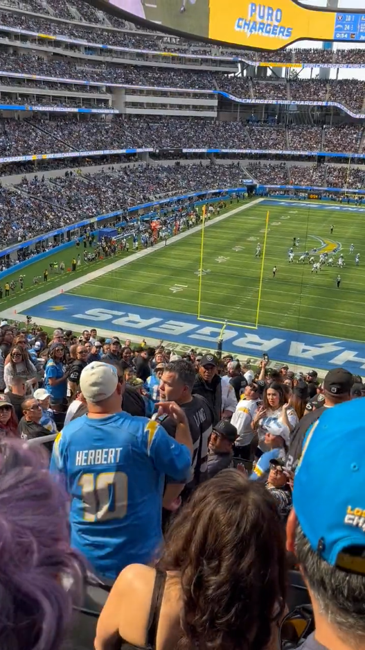 VIDEO: Fight breaks out between fans during rivalry Chargers-Raiders game  at SoFi Stadium