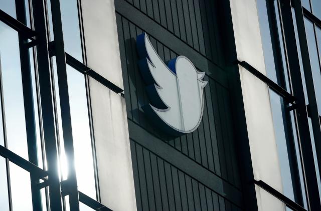 FILE - A Twitter logo hangs outside the company's offices in San Francisco, Dec. 19, 2022. Elon Musk said Thursday, May 11, 2023, that he has found a new CEO for Twitter, or X Corp. as it is now called. He did not name the person but she will be starting in about six weeks. (AP Photo/Jeff Chiu, File)