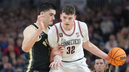 Reuters - Apr 8, 2024; Glendale, AZ, USA;  Connecticut Huskies center Donovan Clingan (32) dribbles against Purdue Boilermakers center Zach Edey (15) in the national championship game of the Final Four of the 2024 NCAA Tournament at State Farm Stadium. Mandatory Credit: Robert Deutsch-USA TODAY Sports