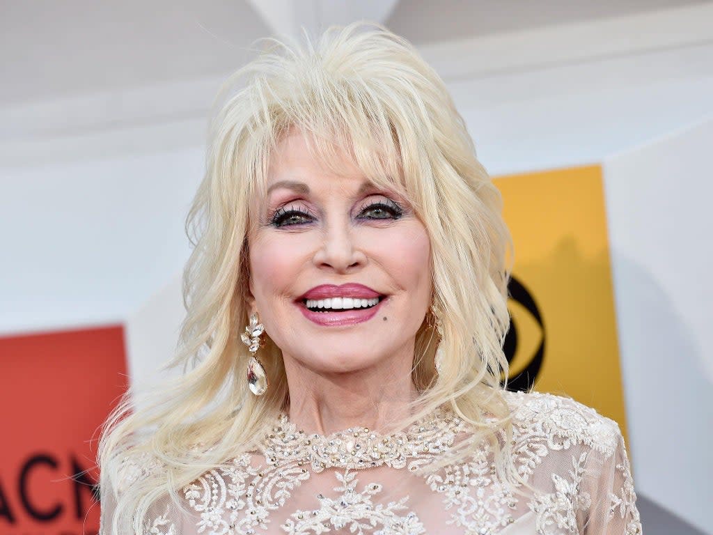 Dolly Parton says she ‘likes to dress up for Carl’ to keep their