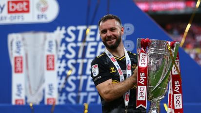 Getty Images - LONDON, ENGLAND - MAY 26:  Adam Armstrong of Southampton celebrates with the trophy at full-time after his side secure promotion to the Premier League after defeating Leeds United during the Sky Bet Championship Play-Off Final match between Leeds United and Southampton at Wembley Stadium on May 26, 2024 in London, England.(Photo by Copa/Getty Images)
