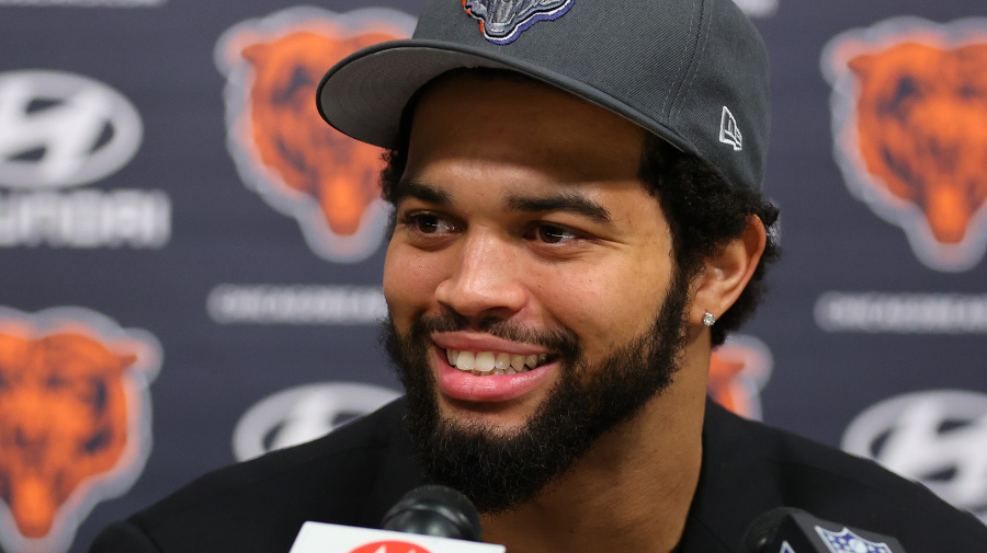 Getty Images - LAKE FOREST, ILLINOIS - APRIL 26: Caleb Williams #18 of the Chicago Bears speaks answers a question from the media during his introductory press conference at Halas Hall on April 26, 2024 in Lake Forest, Illinois. Caleb Williams was drafted first overall in the 2024 NFL Draft on Thursday. (Photo by Michael Reaves/Getty Images)