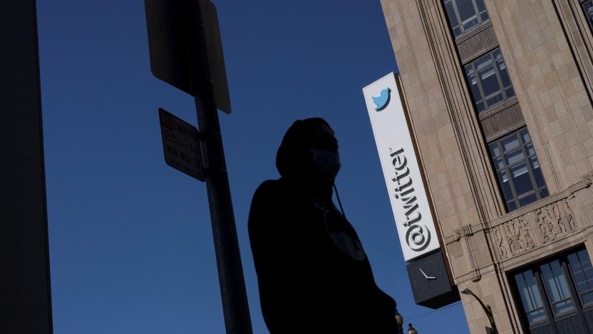 A man walks by a Twitter logo at the company?s headquarters in downtown San Francisco, California, U.S., April 25, 2022. REUTERS/Carlos Barria