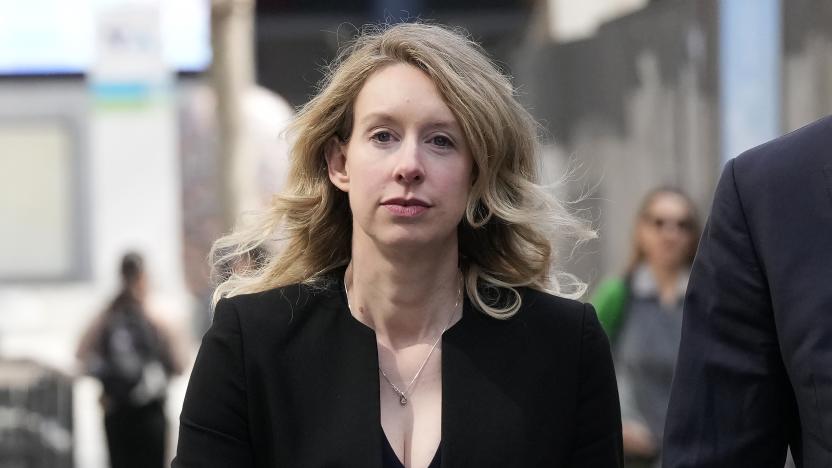 FILE - Former Theranos CEO Elizabeth Holmes leaves federal court in San Jose, Calif., March 17, 2023. Holmes has asked a federal judge, Wednesday, May 17, 2023, to allow her to remain free through the Memorial Day weekend before surrendering to authorities on May 30, to begin her more than 11-year prison sentence for defrauding investors in a blood-testing scam. (AP Photo/Jeff Chiu, File)