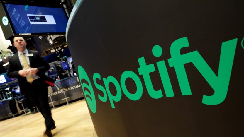 FILE - In this Tuesday, April 3, 2018 file photo, a trading post sports the Spotify logo on the floor of the New York Stock Exchange. U.K. regulators are stepping up scrutiny of the country's music streaming market to see whether there's enough competition, after lawmakers outlined concerns that big online major platforms like Spotify may be too dominant. The U.K.'s competition watchdog said Tuesday, Oct. 19 2021 it will carry out a “market study” to assess whether fresh measures are needed to improve streaming competition. (AP Photo/Richard Drew, File)