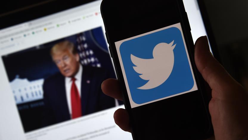 In this photo illustration, a Twitter logo is displayed on a mobile phone with a President Trump's picture shown in the background on May 27, 2020, in Arlington, Virginia. - US President Donald Trump threatened Wednesday to shutter social media platforms after Twitter for the first time acted against his false tweets, prompting the enraged Republican to double down on unsubstantiated claims and conspiracy theories. Twitter tagged two of Trump's tweets in which he claimed that more mail-in voting would lead to what he called a "Rigged Election" this November. (Photo by Olivier DOULIERY / AFP) (Photo by OLIVIER DOULIERY/AFP via Getty Images)