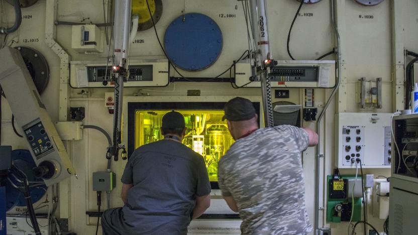 Brian Simmons, right, and Freddy Rodriguez process nuclear operators at the Idaho National Laboratory using master-slave manipulators to work with radioactive material inside a hot cell that hasn't been entered since 1974. Simmons was in the same accident with Ralph Stanton on Nov. 8, 2011, exposing him to alpha radiation-emitting americium and plutonium, which can be deadly when inhaled. (Chad Estes/McClatchy DC/Tribune News Service via Getty Images)