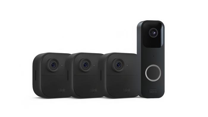 Amazon product shot of three Blink Outdoor 4 cameras and a Blink Video Doorbell lined up side-by-side in front of a white background.