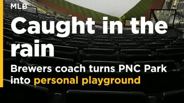 Brewers bench coach turns rain-soaked PNC Park into personal playground