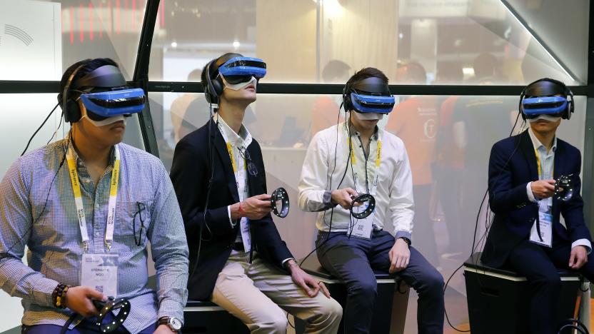 PARIS, FRANCE - MAY 24:  Visitors play a video game with the Acer Windows Mixed Reality Headset during the Viva Technologie show at Parc des Expositions Porte de Versailles on May 24, 2018 in Paris, France.  Viva Technology, the new international event brings together 5,000 startups with top investors, companies to grow businesses and all players in the digital transformation who shape the future of the internet.  (Photo by Chesnot/Getty Images)