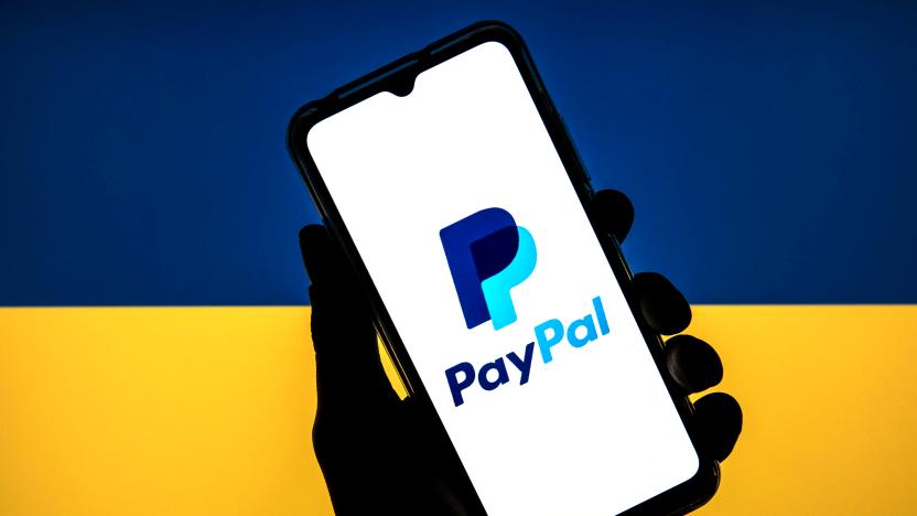 SPAIN - 2022/03/11: In this photo illustration a PayPal logo seen displayed on a smartphone with a flag of the Ukraine in the background. (Photo Illustration by Thiago Prudêncio/SOPA Images/LightRocket via Getty Images)