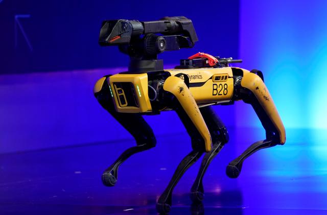 A robot from Boston Dynamics walks around the stage at the WSJTECH live conference in Laguna Beach, California, U.S. October 21, 2019.    REUTERS/ Mike Blake