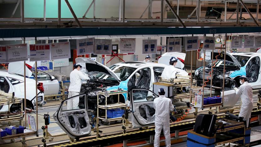 Employees work on a production line inside a Dongfeng Honda factory after lockdown measures in Wuhan, the capital of Hubei province and China's epicentre of the novel coronavirus disease (COVID-19) outbreak, were further eased, April 8, 2020. REUTERS/Aly Song