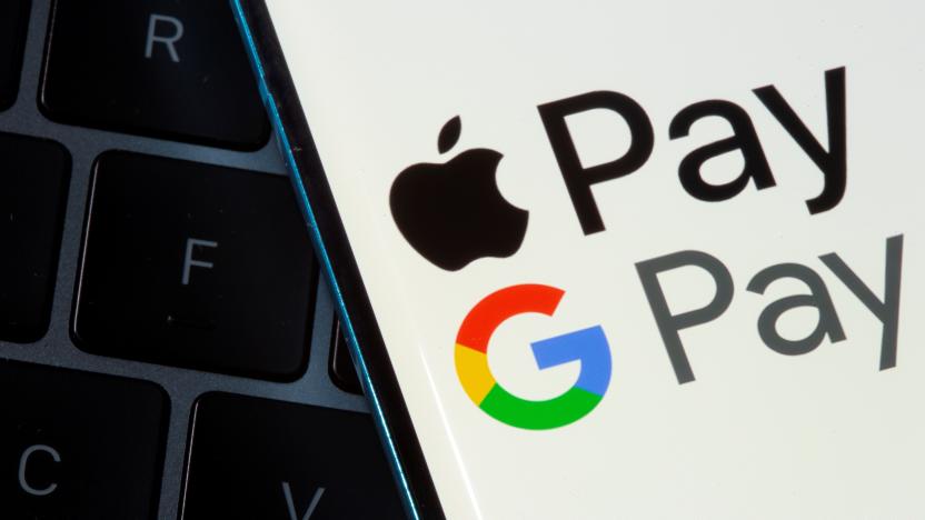 A smartphone with Apple Pay and Google Pay logos is placed on a laptop in this illustration taken on July 14, 2021. REUTERS/Dado Ruvic/Illustration