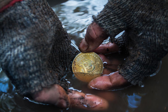 March 10, 2018 Thailand, Koh phangan: Dirty man's hands found in the ground a bitcoin coin. Photo was taken during the shooting of a short film on the topic of cryptocurrency Denis Kartavenko for his project on YouTube