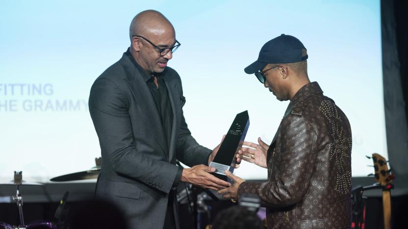 Recording Academy CEO Harvey Mason, jr., presents Pharrell Williams with the Creators Leadership Award during the GRAMMYs on the Hill Awards on Wednesday, April 26, 2023, at The Hamilton in Washington. (Photo by Kevin Wolf/Invision/AP)