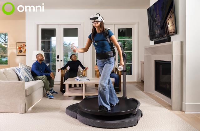 A person plays the Omni One in their living room 