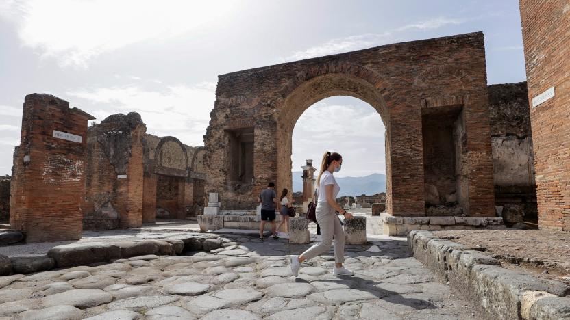 Tourists visit the archaeological site of the ancient Roman city of Pompeii, as it reopens to the public after much of the country became a "yellow zone", loosening coronavirus disease (COVID-19) restrictions, in Pompeii, Italy, April 27, 2021. REUTERS/Ciro De Luca